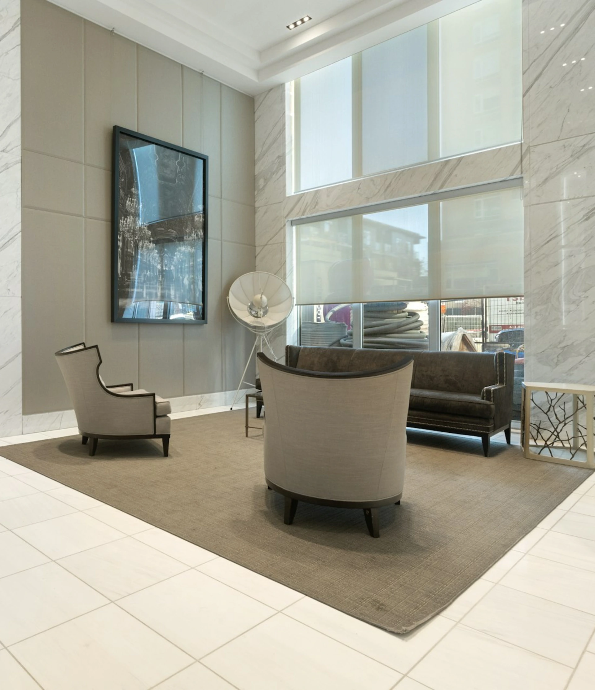 a room with a couch and chairs